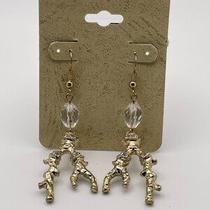 gold-toned earrings with a branch-like design and clear beads.